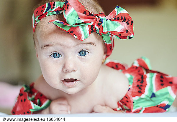 Portrait of dressed baby girl with hair-band
