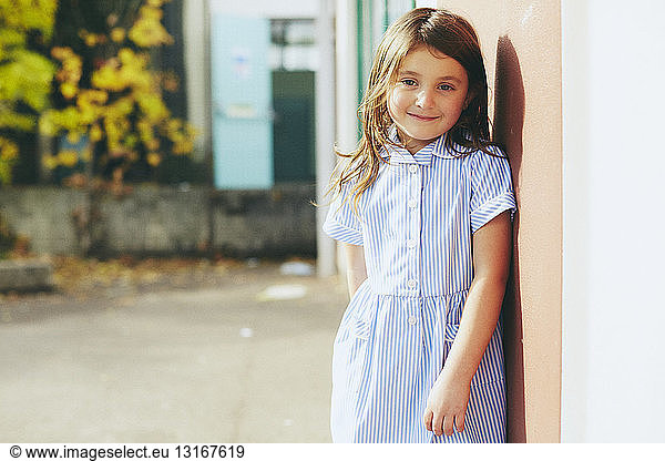 Portrait of elementary schoolgirl in playground