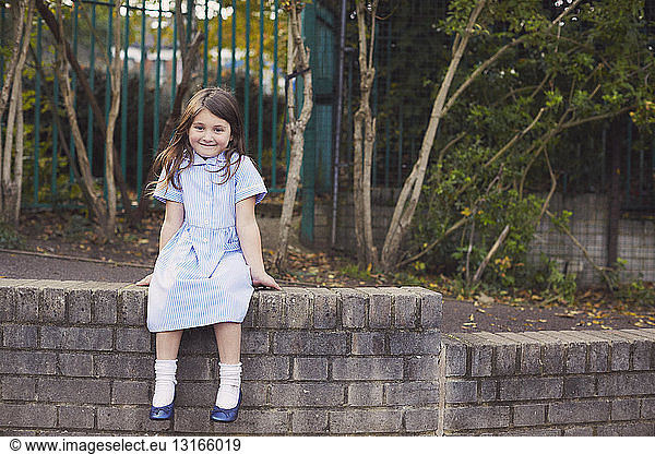 Portrait of elementary schoolgirl in school playground