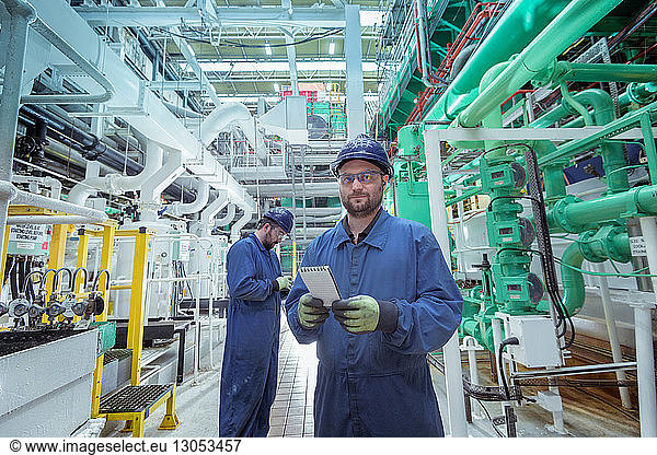 Portrait of engineer in turbine hall in nuclear power station