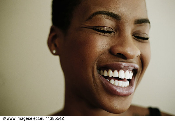 Portrait of face of laughing Black woman