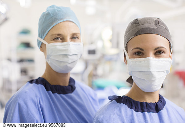 Portrait of female doctors wearing scrubs in operating theater