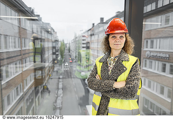 Portrait of female worker wearing hardhat
