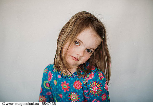 portrait of five year old girl against white background