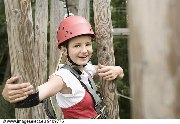 Portrait of girl climbing crag  smiling