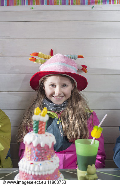 Portrait of girl with birthday cake