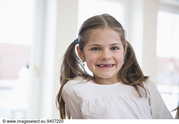 Portrait of girl with bunches  smiling