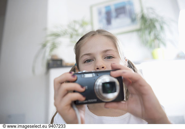 Portrait of girl with camera