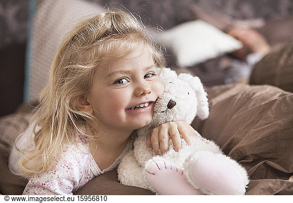 Portrait of girl with her cuddly toy