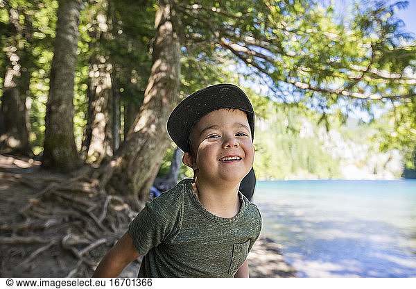 Portrait of happy four year old boy at Lindeman Lake  Chilliwack  B.C.