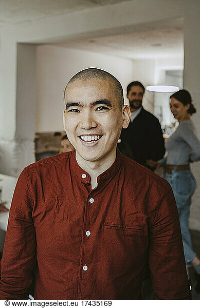 Portrait of happy male entrepreneur in startup company