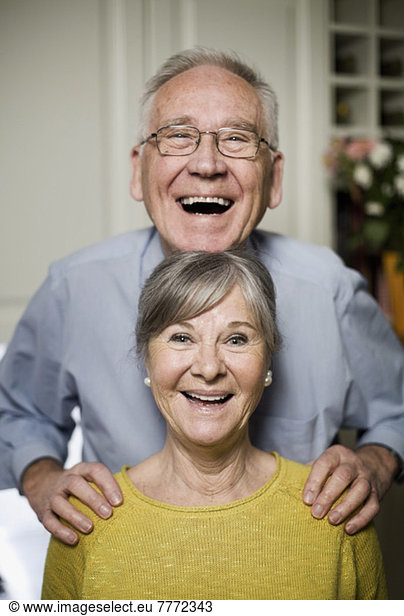 Portrait of happy playful senior couple