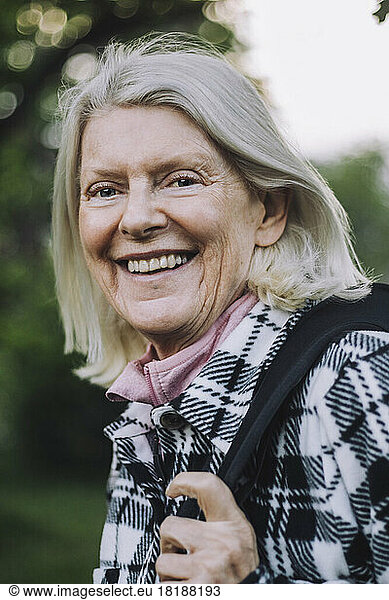 Portrait of happy senior woman with white hair