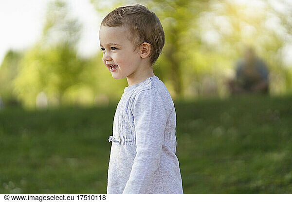 Portrait of happy toddler in a park