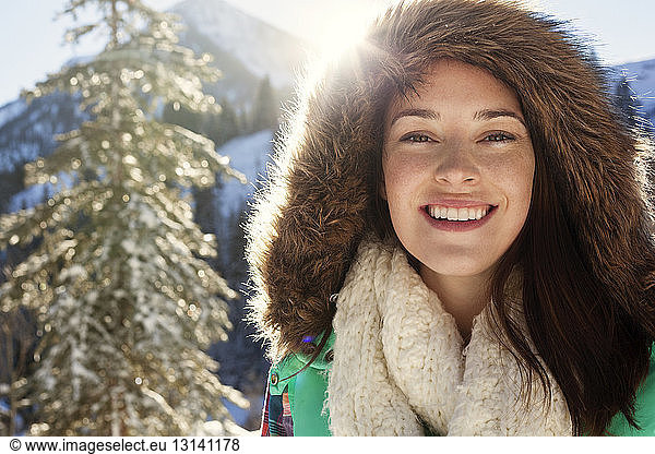 Portrait of happy woman in warm clothing