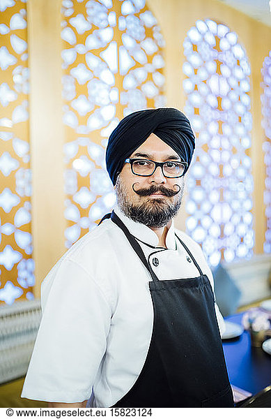 Portrait of Indian chef in restaurant