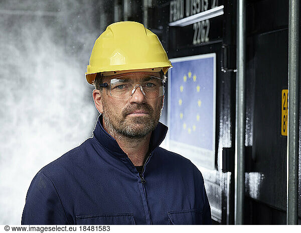 Portrait of industrial worker looking at camera