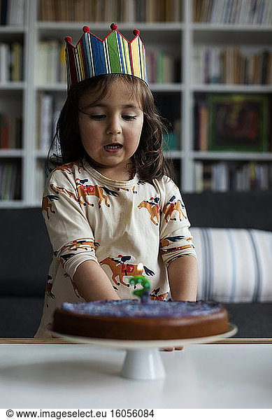 Portrait of little girl celebrating birthday at home