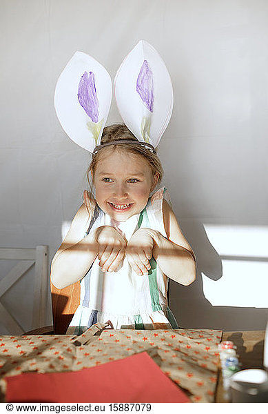 Portrait of little girl with self-made bunny ears