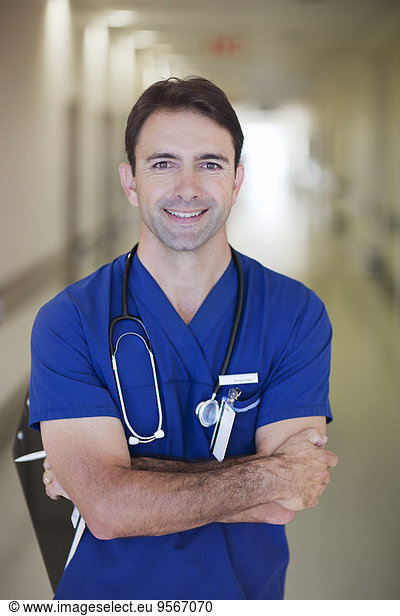 Portrait of male doctor in hospital corridor