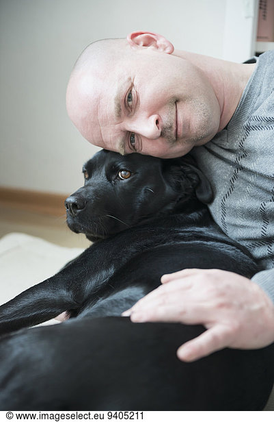 Portrait of man with his dog  smiling