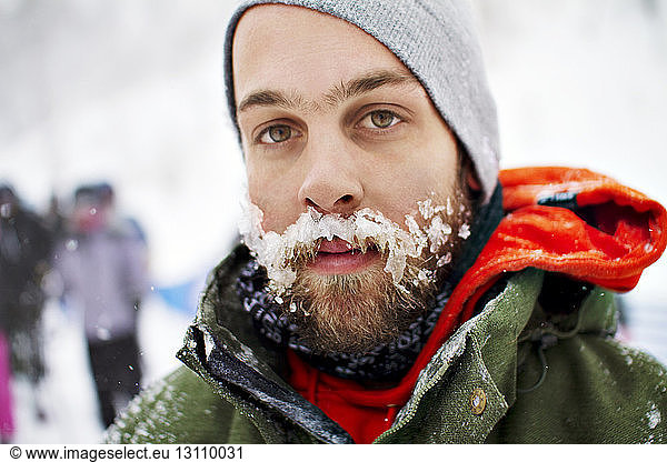 Portrait of man with snow on mustache
