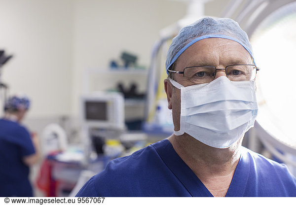 Portrait of masked surgeon in hospital