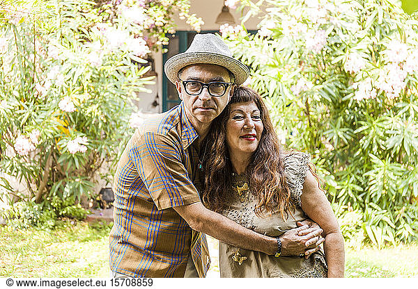 Portrait of mature couple  embracing in garden