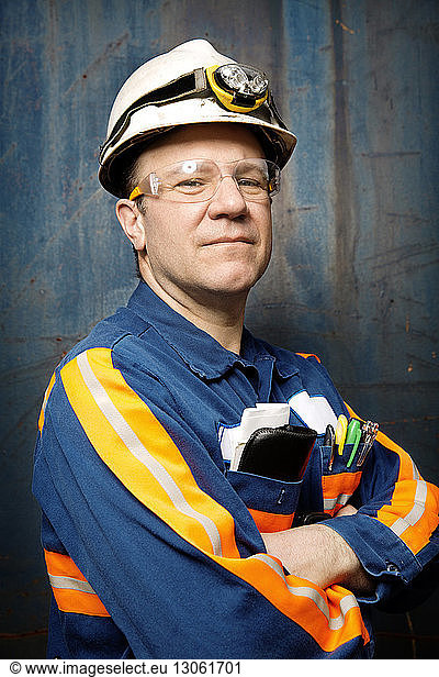 Portrait of mature male worker at recycling plant