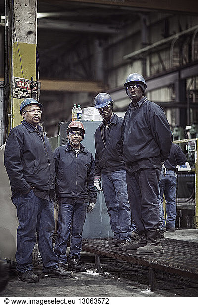 Portrait of metal workers in factory