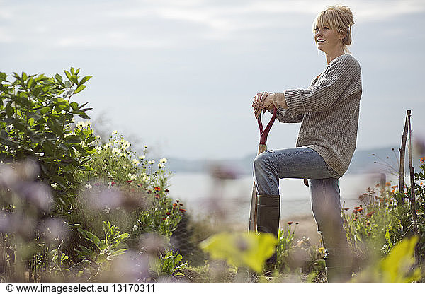 Portrait of mid adult woman in organic garden  Orust  Sweden