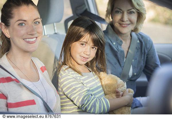 Portrait of multi-generation women inside car
