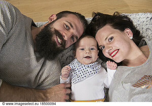 Portrait of parents with baby boy