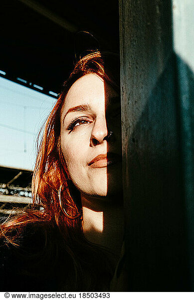 portrait of red-haired woman at sunset