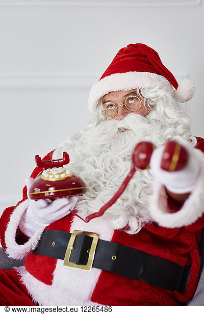 Portrait of Santa claus with phone
