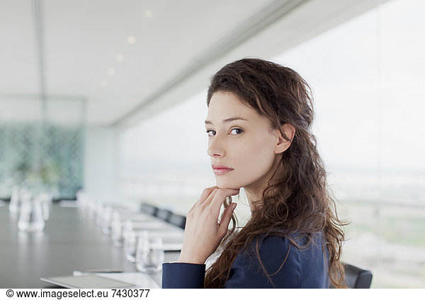 Portrait of serious businesswoman in conference room