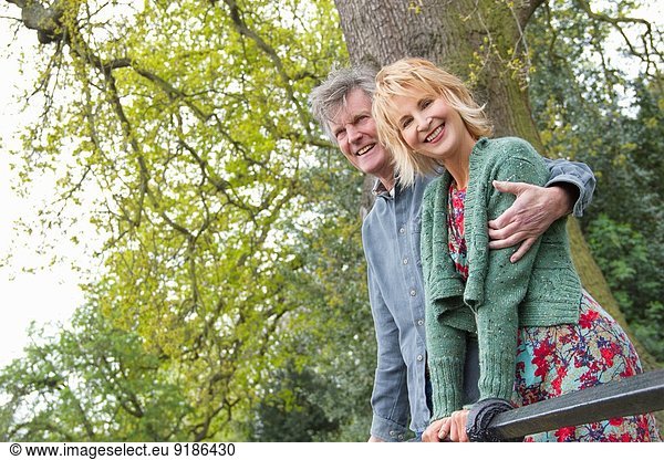 Portrait of smiling adult couple in park