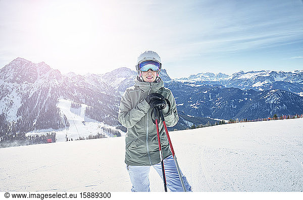 Portrait of smiling female skier on ski slope
