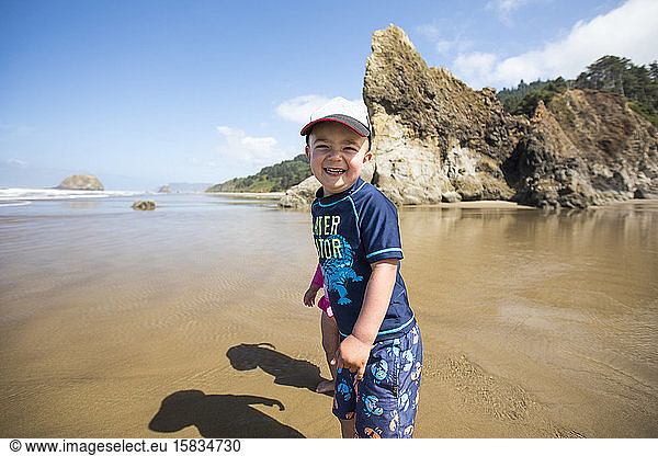 portrait of smiling happy boy at the beach.