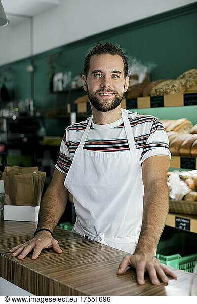Portrait of smiling male entrepreneur in bakery