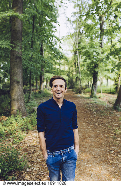 Portrait of smiling man in nature