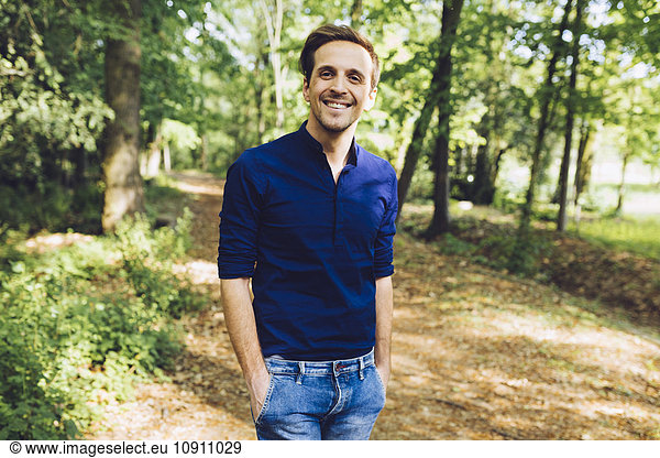 Portrait of smiling man in nature