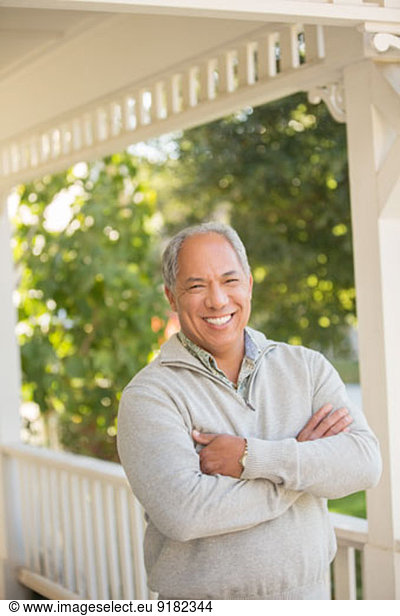 Portrait of smiling man on porch