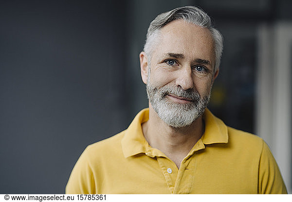 Portrait of smiling mature man with grey beard and blue eyes Portrait ...