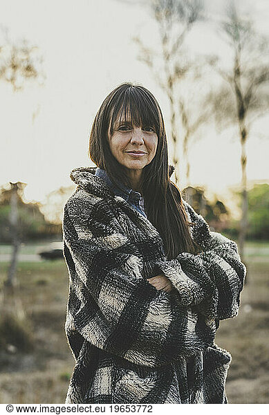 Portrait of smiling mid adult woman with selective focus