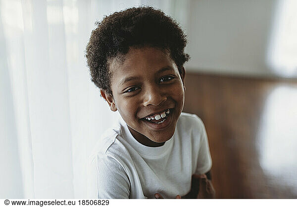 Portrait of smiling school-aged boy looking at camera