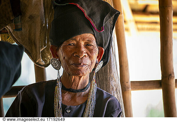 Portrait of smiling senior lady of Akhu tribe near Kengtung  Myanmar
