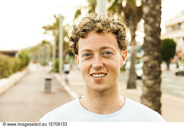 Portrait of smiling young strawberry blonde man