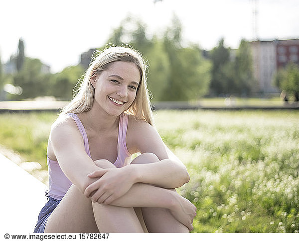 Portrait of smiling young woman in summer
