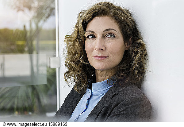 Portrait of successful businesswoman  thinking